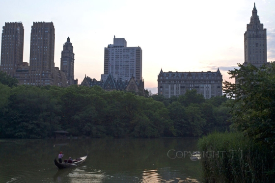 Gondola and gondolier at dusk on the Great Lake in Central Park Manhattan New York City